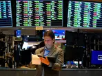 Asian markets waver as investors await central bank rate decisions