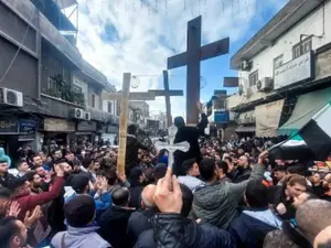 Hundreds hit the streets as protest erupts over burning of Christmas tree near Syria's Hama