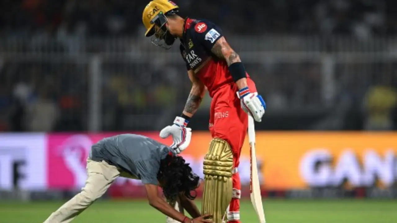 IPL 2025: Fan breaches security at Eden Gardens to touch Virat Kohli's feet during KKR-RCB opener-WATCH IPL 2025: Fan breaches security at Eden Gardens to touch Virat Kohli's feet during KKR-RCB opener-WATCH