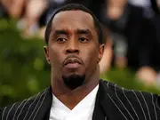 Sean 'Diddy' Combs' former aide claims music mogul kidnapped her in a plot to kill Kid Cudi