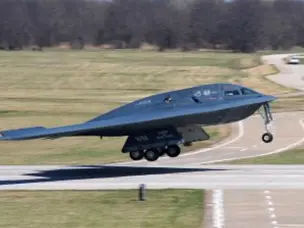How many crew members fly the B-2 bomber?