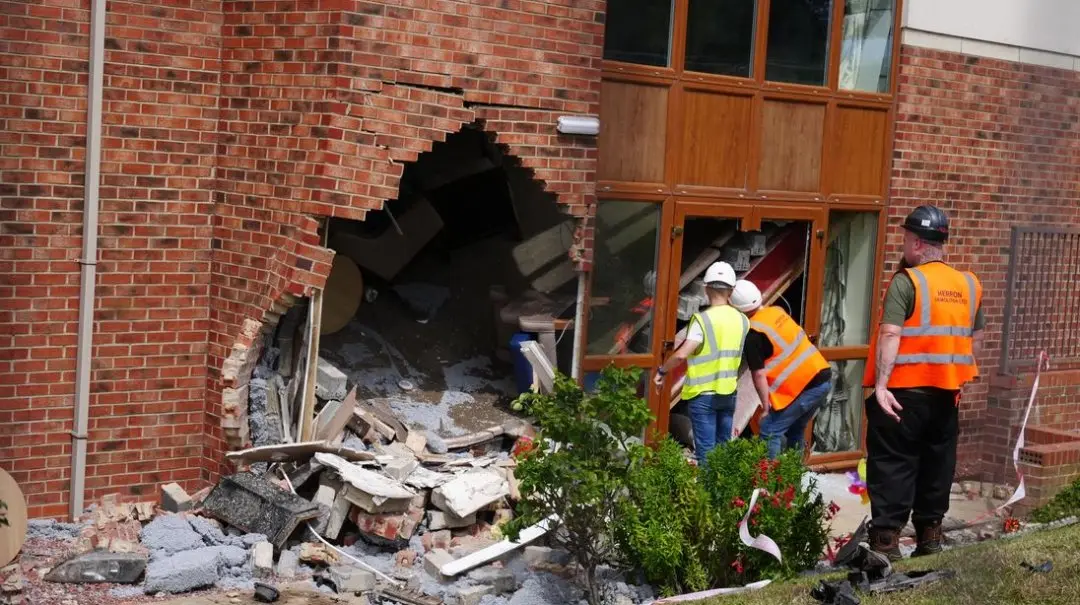 'Whole top floor caved in': BMW crashes into care home during police chase in UK, two women die