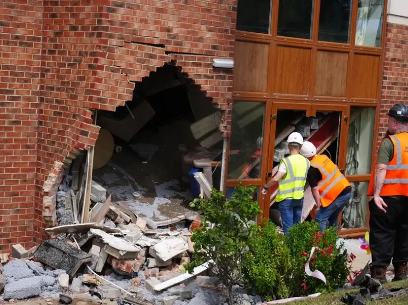 'Whole top floor caved in': BMW crashes into care home during police chase in UK, two women die 'Whole top floor caved in': BMW crashes into care home during police chase in UK, two women die