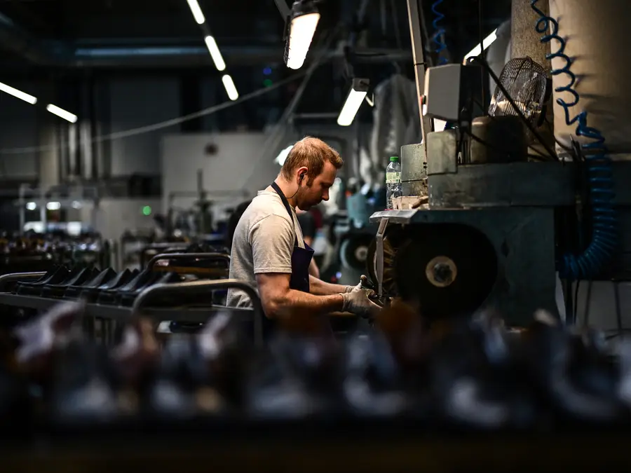 US factory output stalls in July amid tariff pressures