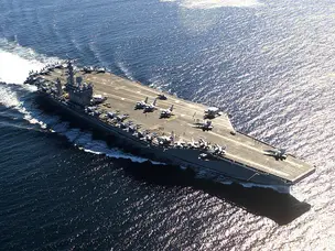 B-2 Bomber vs Aircraft Carrier: Which symbol of power sends a stronger message?