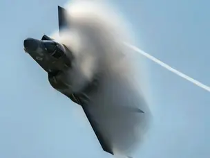 How do fighter jets fly in freezing cold at high altitudes?