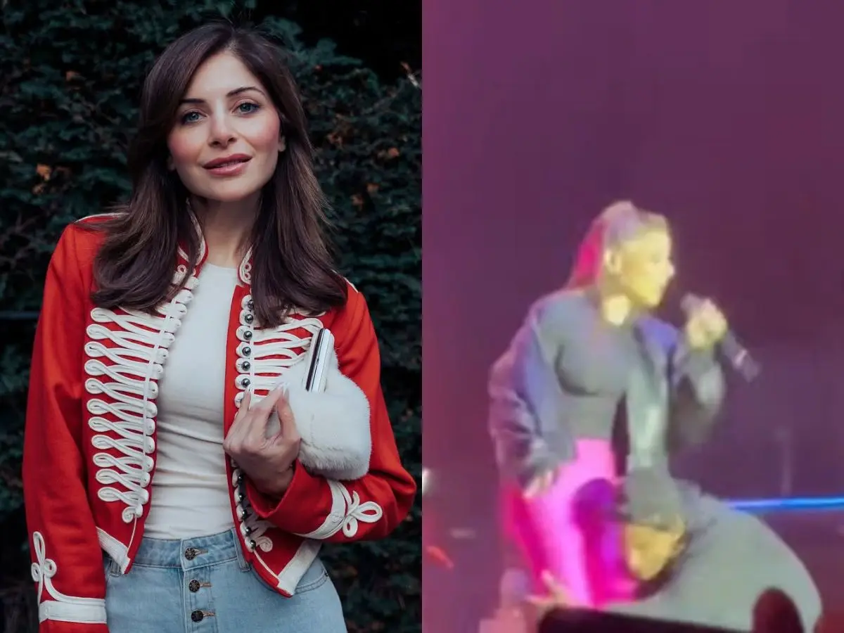 Kanika Kapoor handles an awkward moment with calmness after fan grabs her on stage | Watch Kanika Kapoor handles an awkward moment with calmness after fan grabs her on stage | Watch