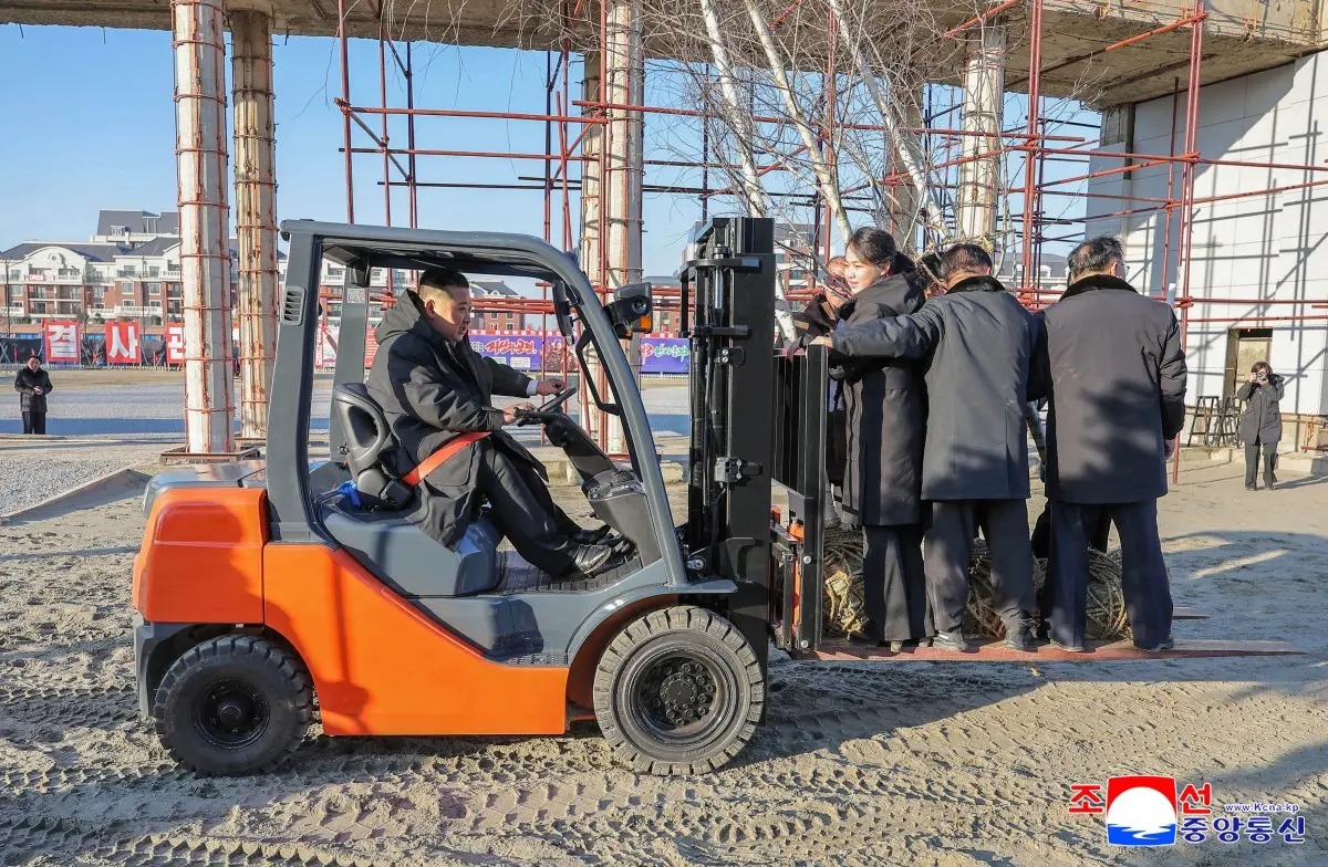 Bizarre photos show Kim Jong Un lifting daughter Ju Ae and staff on a forklift