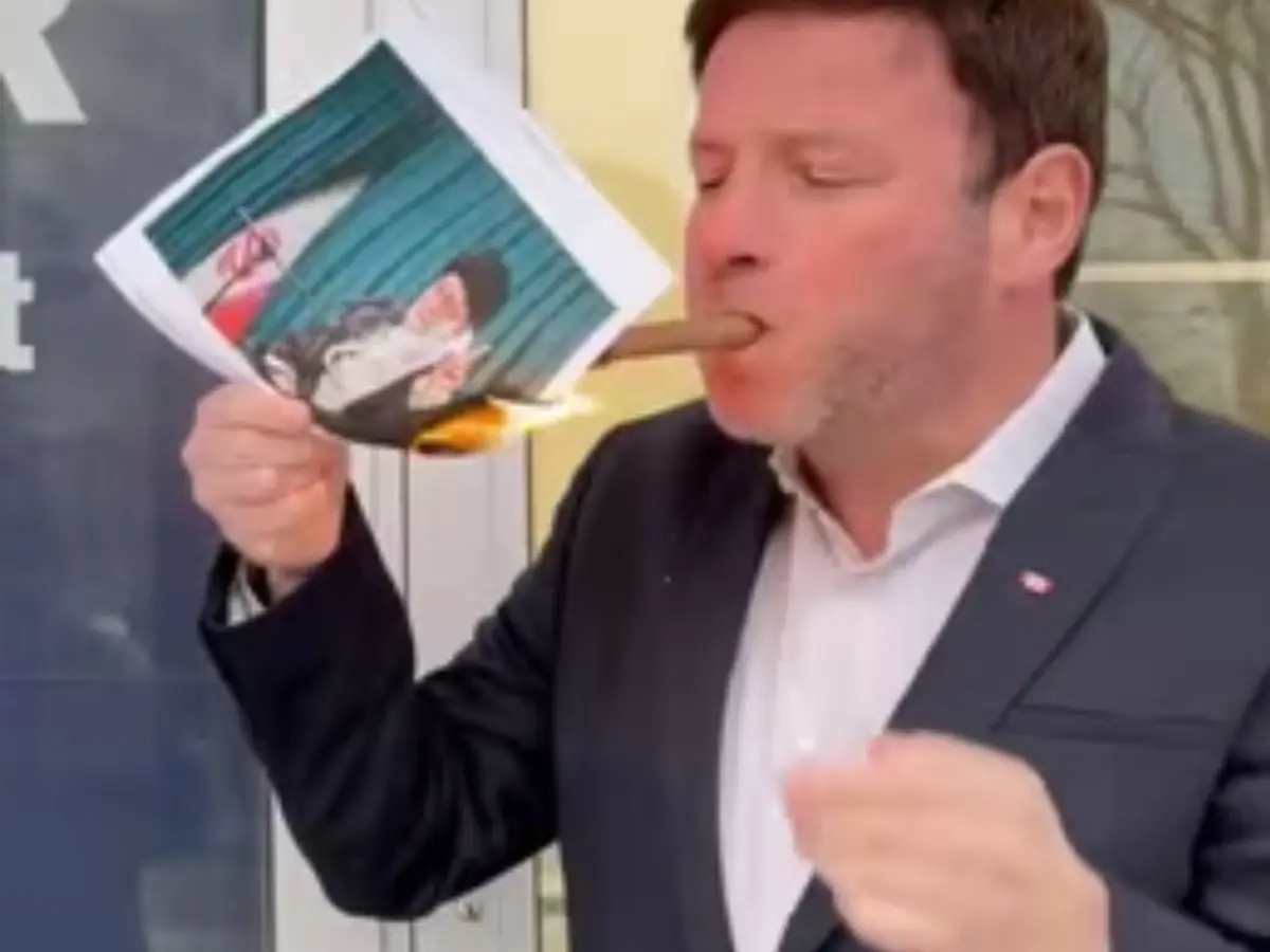 Canadian MP lights cigar with Khamenei's burning photo amid Iran protest, joins viral trend | WATCH Canadian MP lights cigar with Khamenei's burning photo amid Iran protest, joins viral trend | WATCH