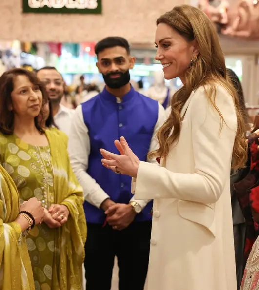 Kate Middleton talking with Indian community