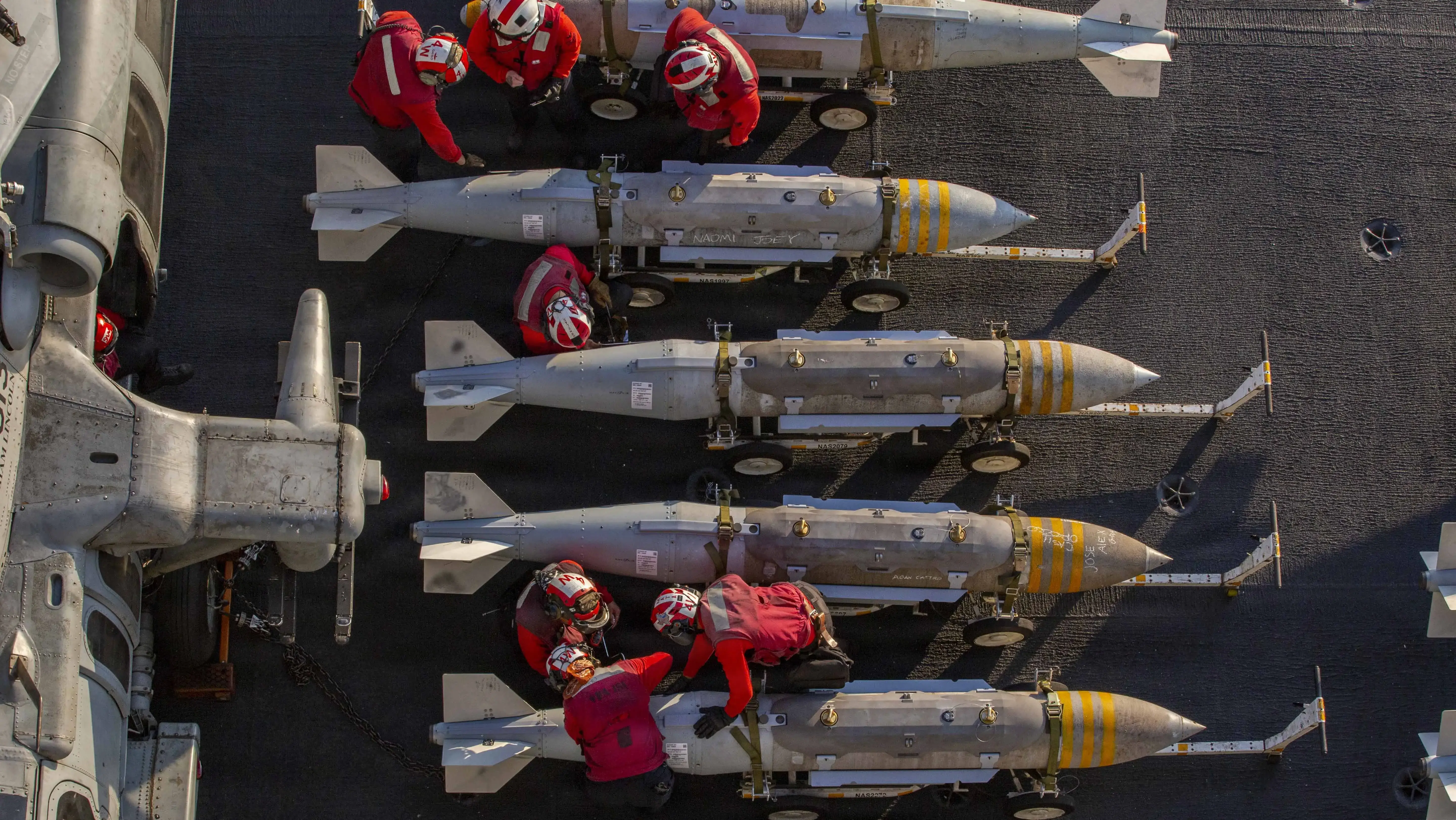 'Names on the bombs': Why USS Abraham Lincoln sailors are writing on weapons headed for Iran