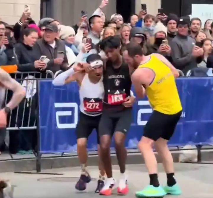 WATCH: Collapsed near finish line, two participants carry runner to complete Boston Marathon