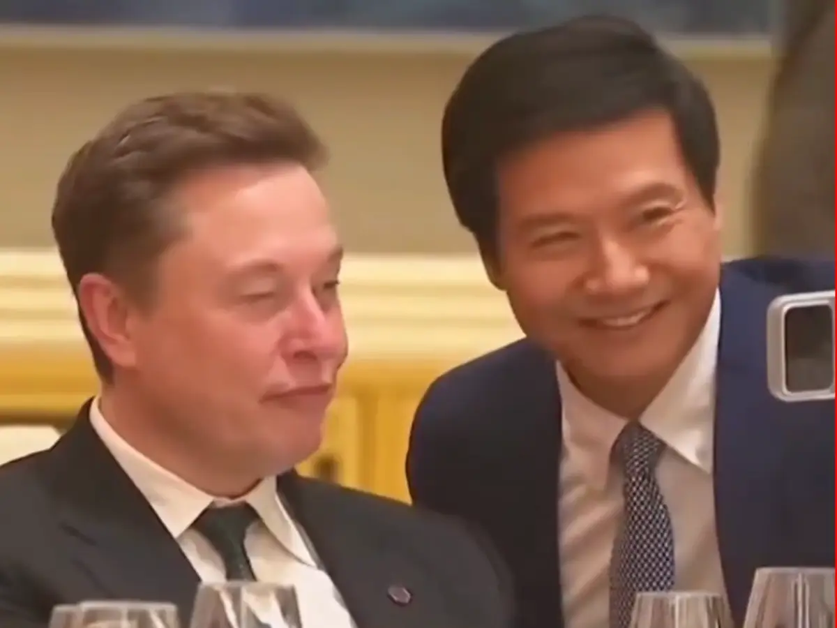 Xiaomi CEO Lei Jun looks smitten as he takes a selfie with his rival Elon Musk - Watch