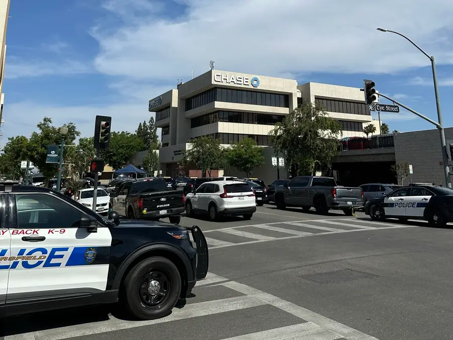 Bakersfield bank hostage situation: Major police response underway as man with bomb strapped to chest hijacks California bank