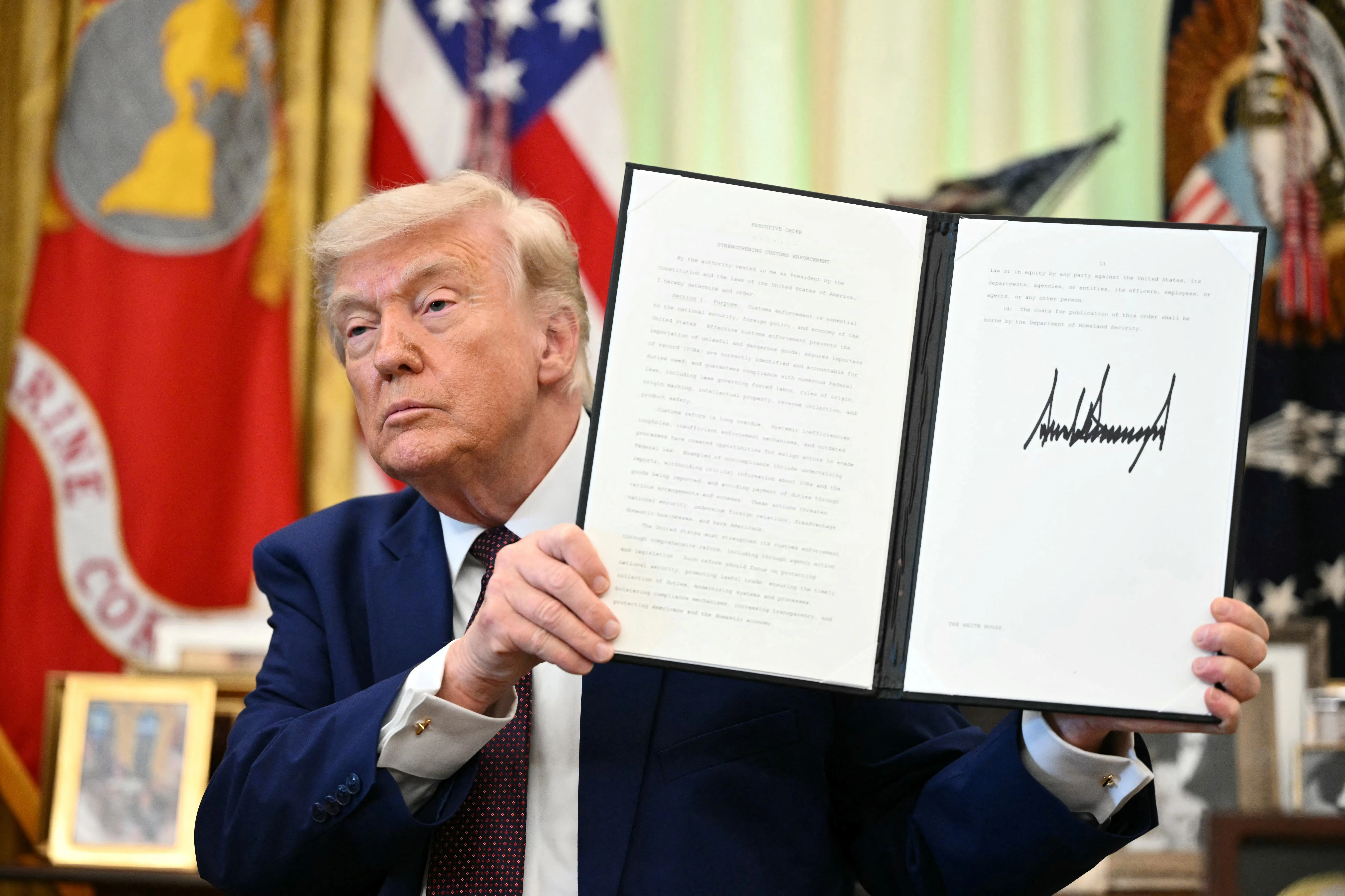 Trump signs executive order making easier to fire 8,000 senior federal employees