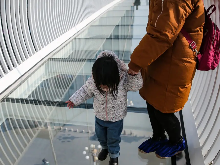 Glass bridge in China cracks after being poked with an umbrella, official says it is safe