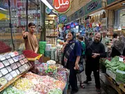 Iran feels the heat of fresh sanctions, Tehran says can withstand pressure